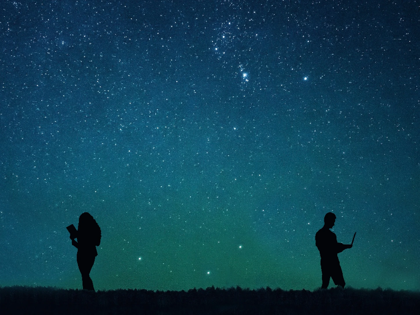 Two distant silhouettes beneath the same star-filled sky, one looking at a phone, the other at a laptop